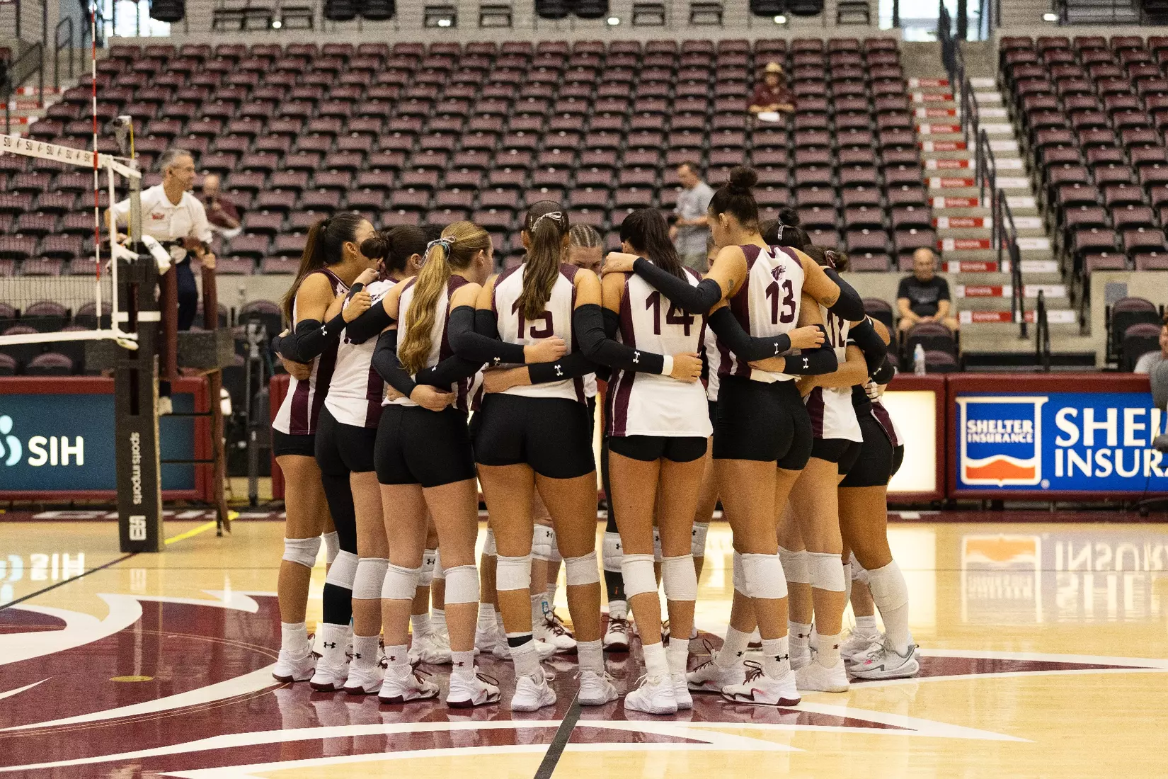 The team huddles prior to the start of the match.