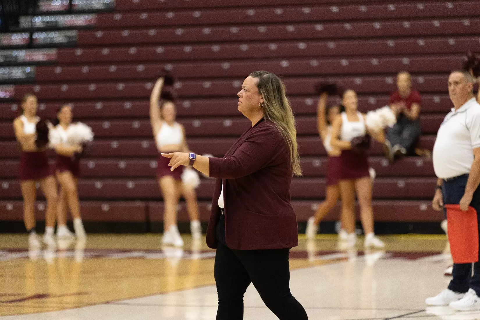 Head Coach Brittany Harry points and directs her team.