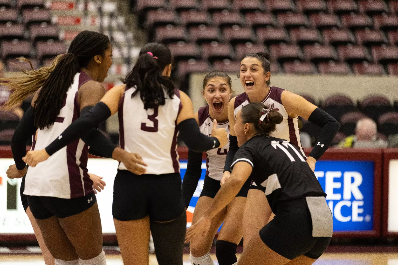 The team ecstatically celebrates a point.