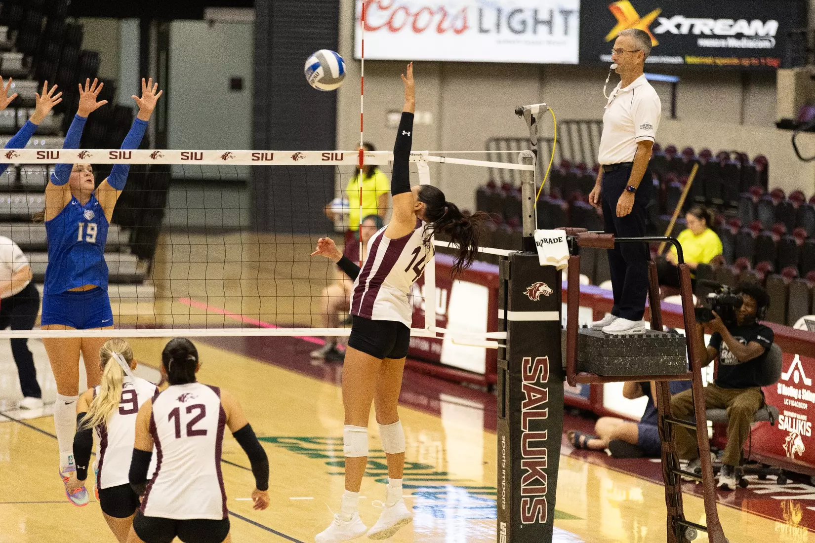 Ella Swansiger smacks a ball over the net.
