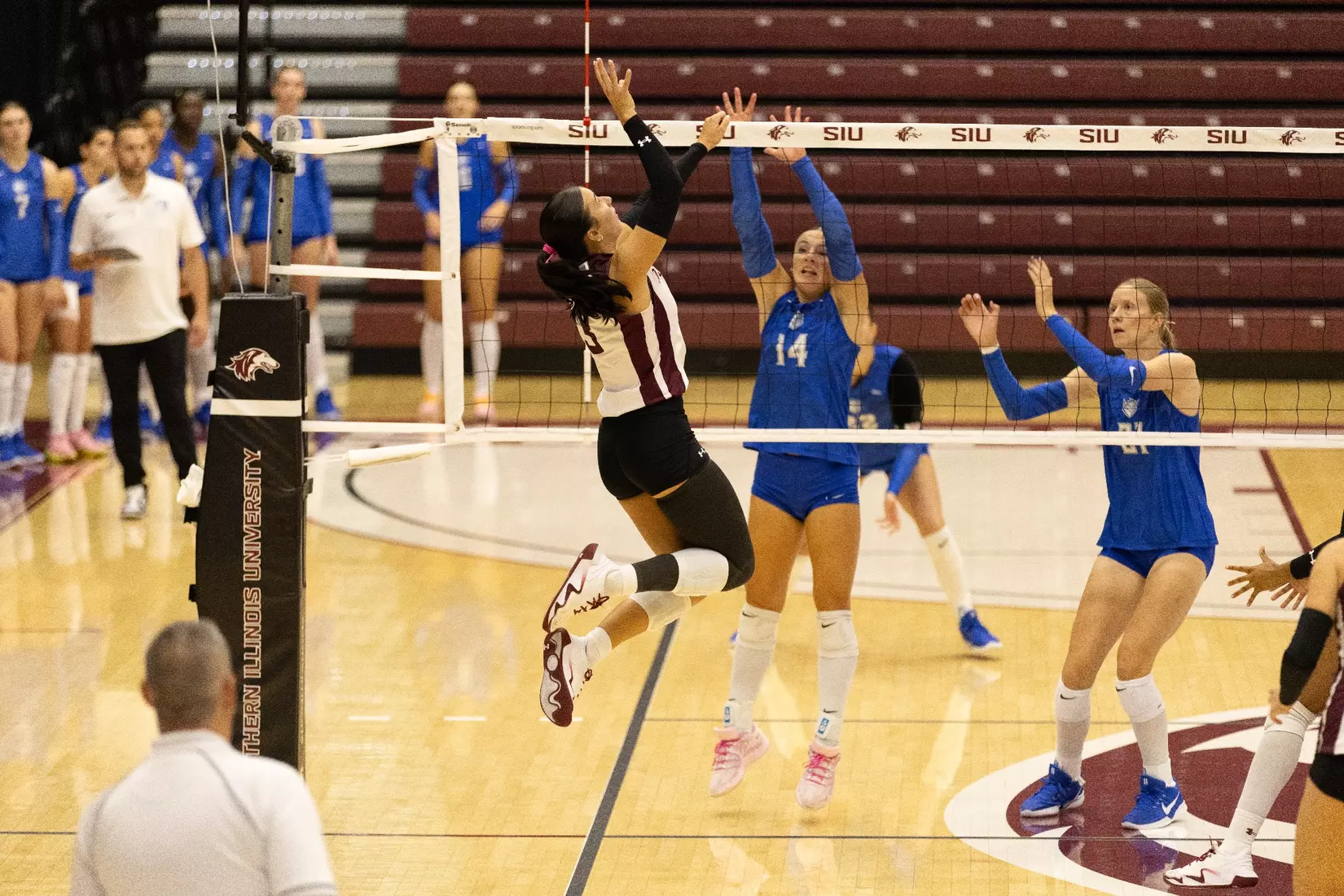McKenzie Moeller jumps up for a ball.