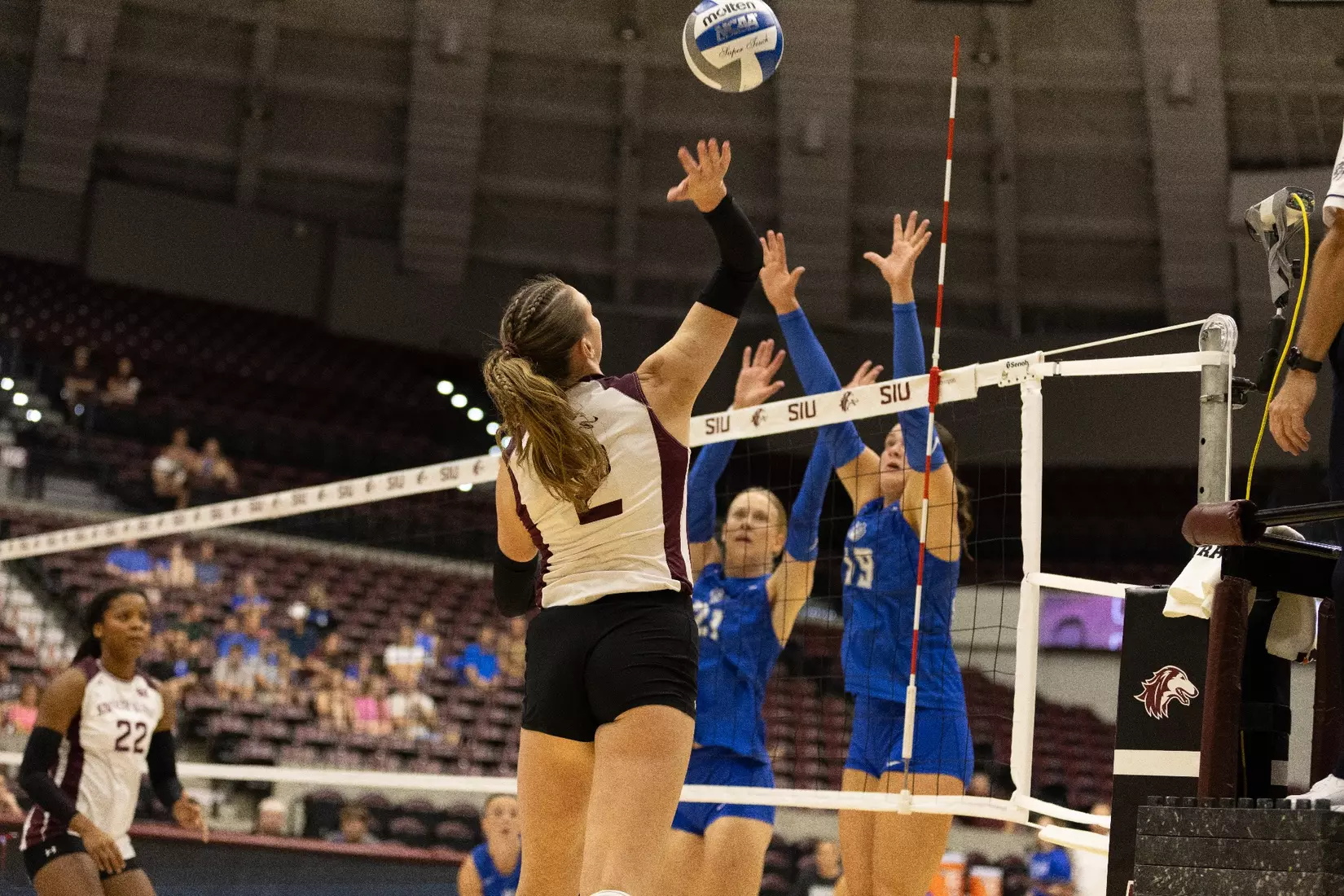 Natalie Vance swings her arm back to attack a ball.