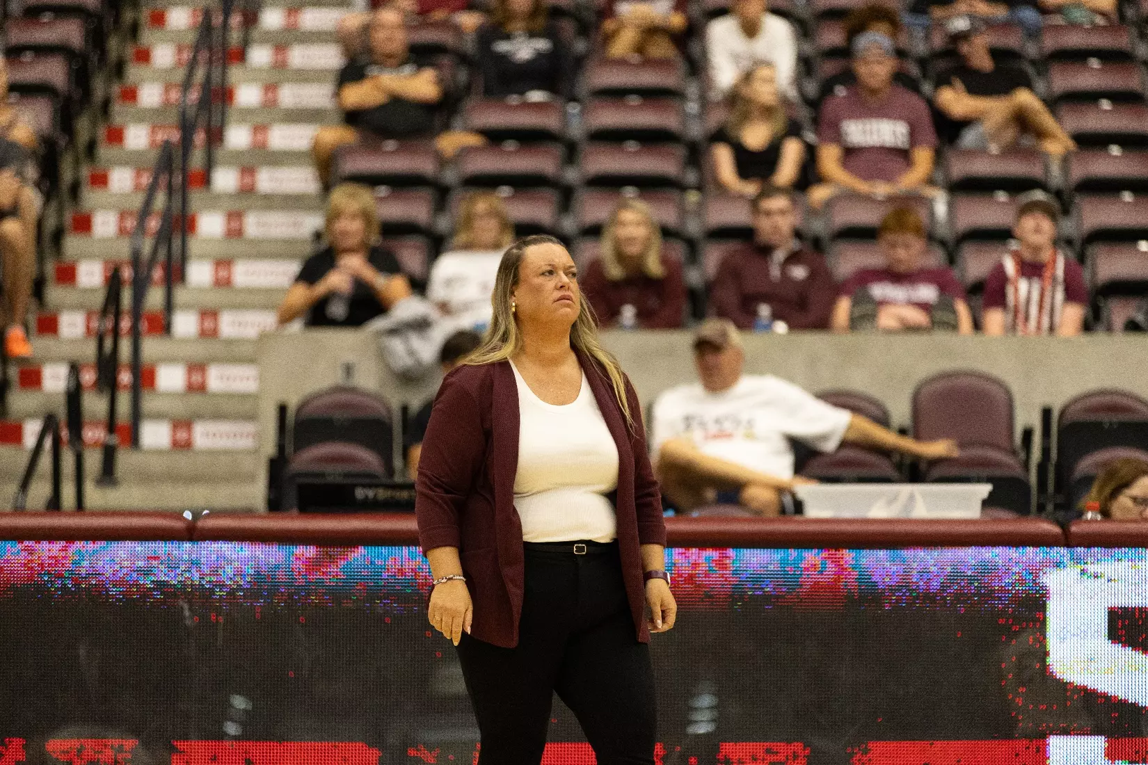 Head Coach Brittany Harry looks on during the match.