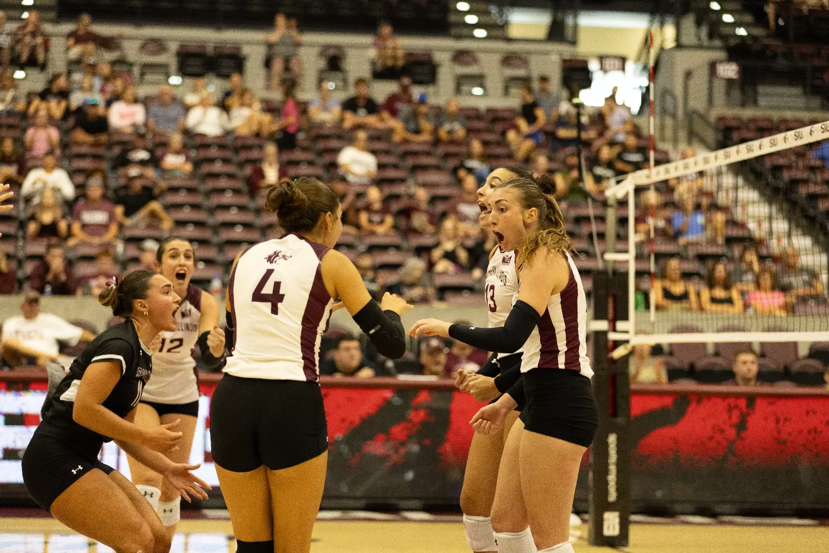 The team celebrates after a point.