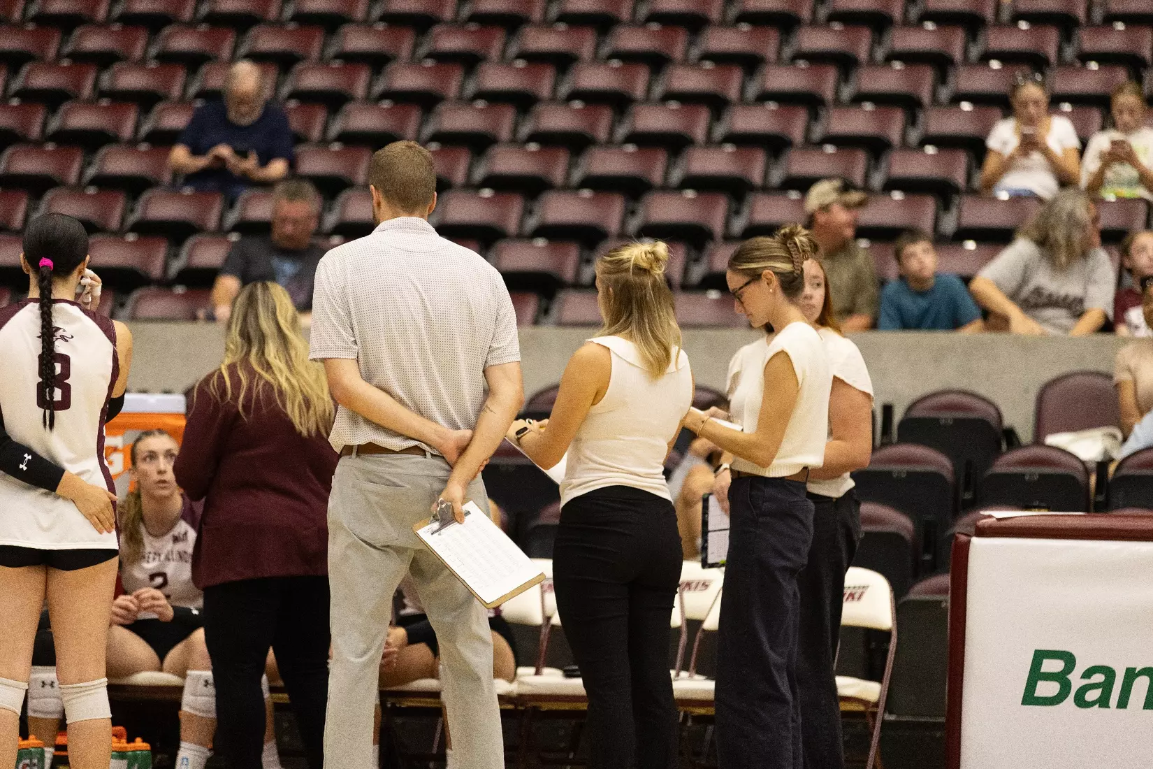 The coaching staff looks on during a team timeout.