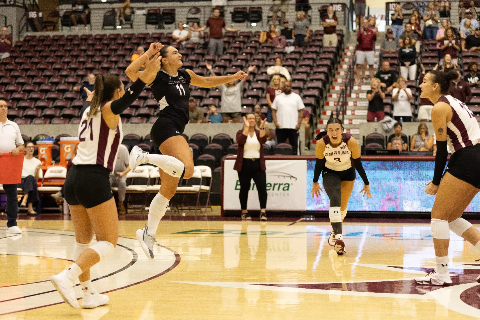 Jillian Shaneyfelt jumps and celebrates with the rest of her team.