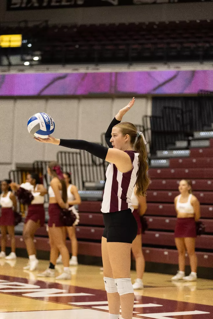 Julia Laidig looks at the ball and puts her hand in the air prior to her serve.