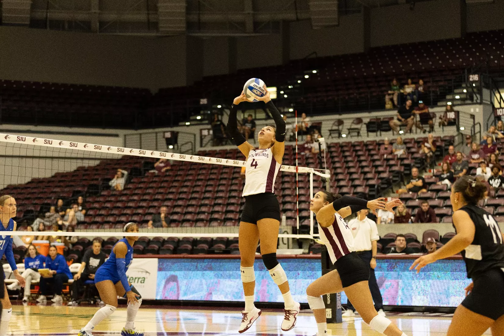 Ella McFarland sets a ball above her head.