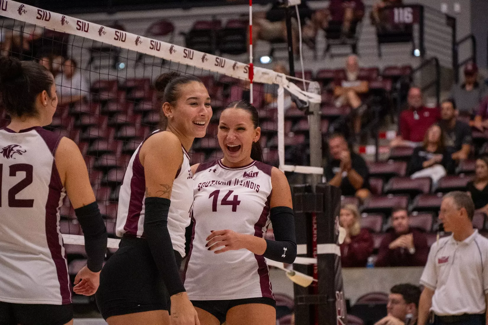 Ella Swansiger and Beatriz Piaia share a laugh after a point.