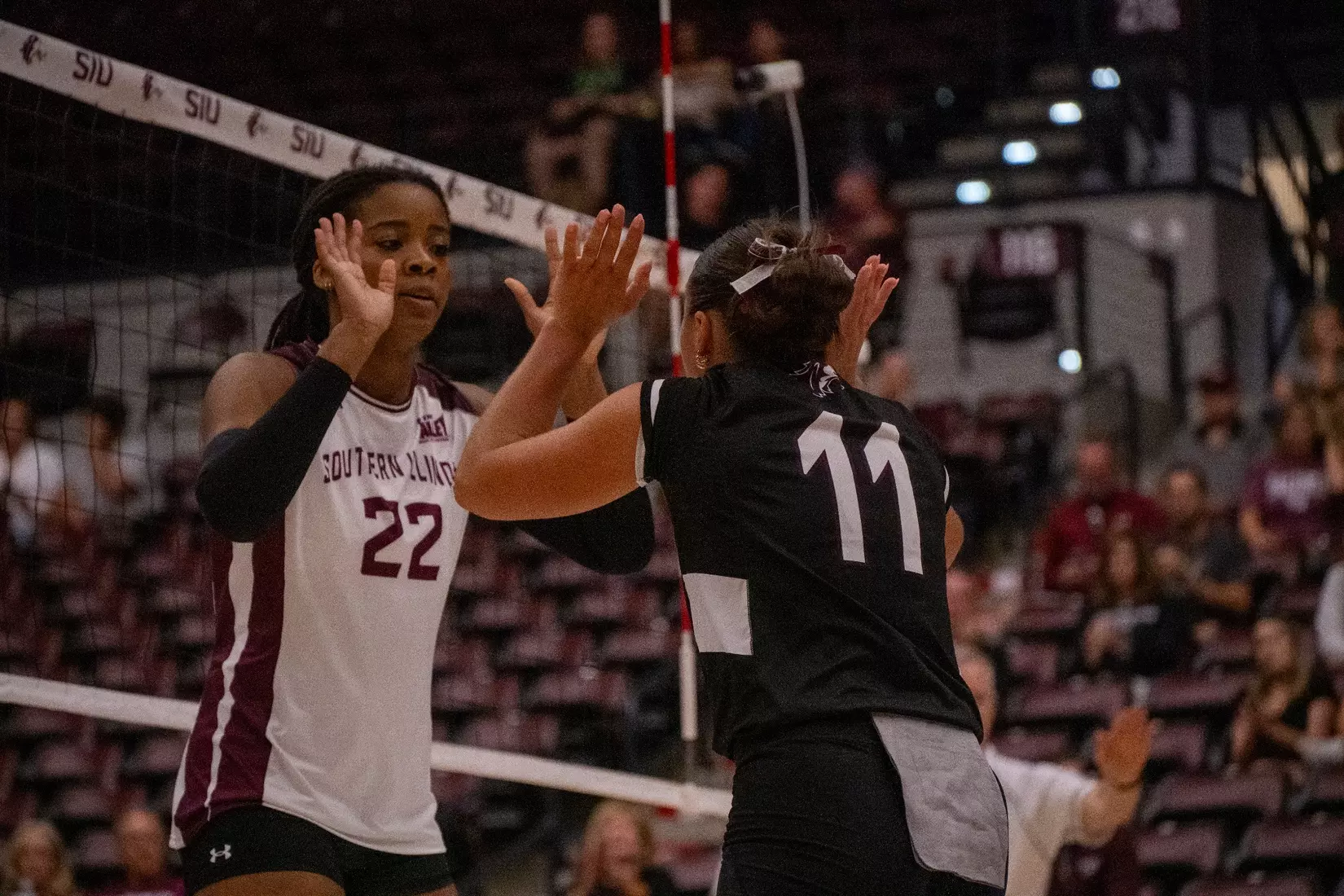 Jillian Shaneyfelt and Chloe Anderson double high five.