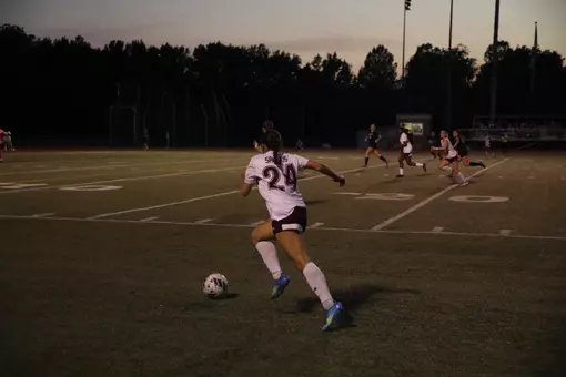 Celina Pinelli runs toward the ball during a night soccer match against Lindenwood