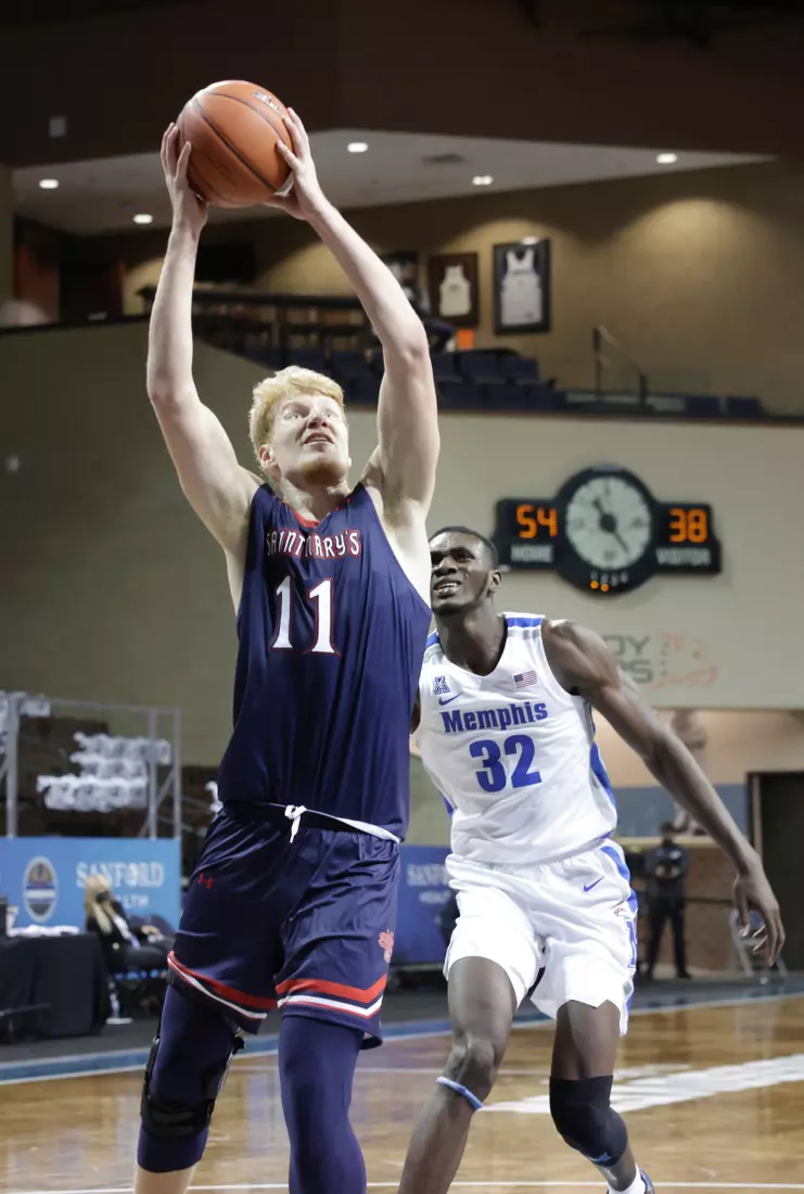 Matthias Tass #11 of the St. Mary's Gaels gets past Moussa Cisse #32 of the Memphis Tigers during the Bad Boy Mowers Crossover Classic at the Sanford Pentagon in Sioux Falls, SD. (Photo by Richard Carlson/Inertia)