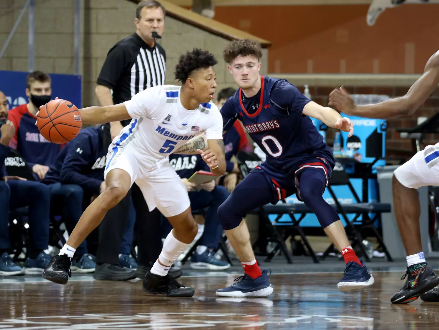 Boogie Ellis #5 of the Memphis Tigers looks to drive past Logan Johnson #0 of the St. Mary's Gaels during the Bad Boy Mowers Crossover Classic at the Sanford Pentagon in Sioux Falls, SD. (Photo by Dave Eggen/Inertia)
