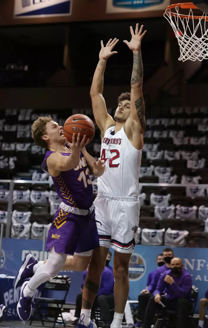 Bowen Born #13 of the Northern Iowa Panthers goes for a layup as Dan Fotu #42 of the St. Mary's Gaels defends during the Bad Boy Mowers Crossover Classic at the Sanford Pentagon in Sioux Falls, SD. (Photo by Richard Carlson/Inertia)