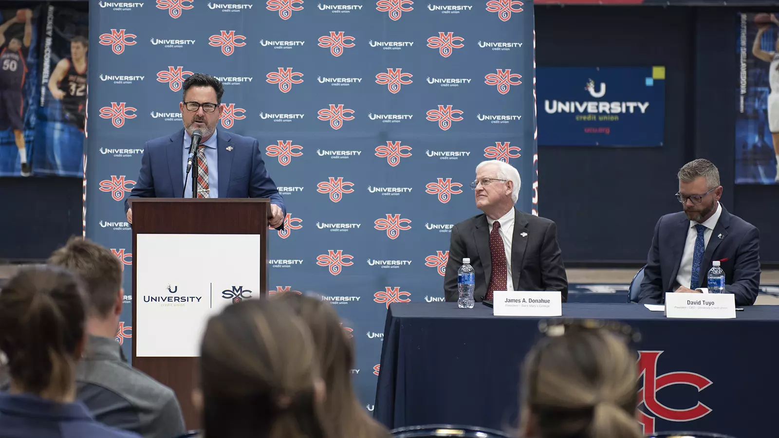 Vice President for Intercollegiate Athletics Mike Matoso speaking in front of the audience.