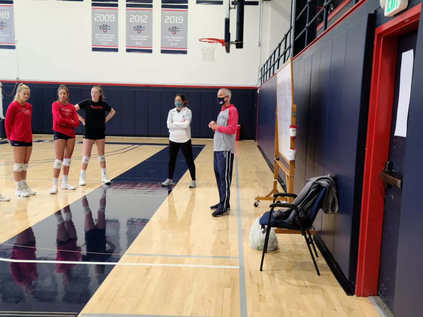 Coaches Rob Browning and Mandy Bible talk to the Gaels - at Madigan Gym, Moraga, Calif., Jan. 8, 2021