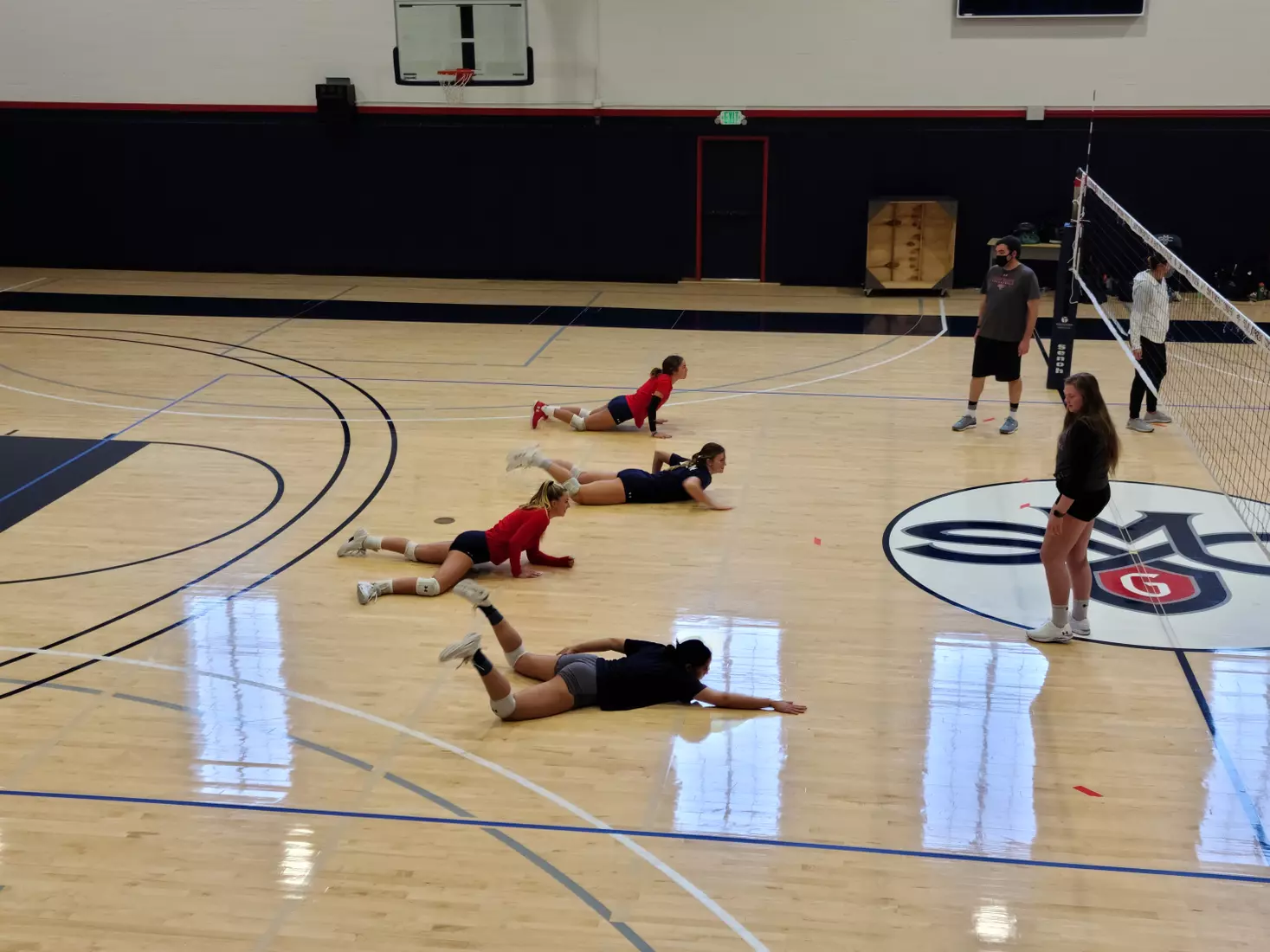 Four Gaels work on their pancake drill - at Madigan Gym, Moraga, Calif., Jan. 8, 2021