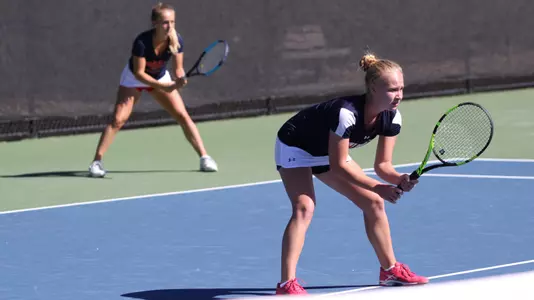 Mariia Kozyreva (right) and Aubane Ville (left) prepare to receive a serve during the first day of the 2017 Saint Mary's Invitational at the Tim Korth Tennis Complex on Oct. 6, 2017