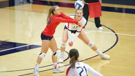 Madi Wilkerson (left) had a match-high 16 digs Thursday and Lindsey Knudsen (right) chipped in 11.