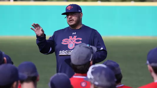 Saint Mary's baseball head coach Eric Valenzuela addresses the team before the start of the first full practice on Jan. 26, 2018, at Louis Guisto Field
