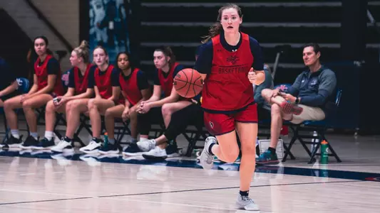 WBB practice photo of Brianna Simonich dribbling up the court