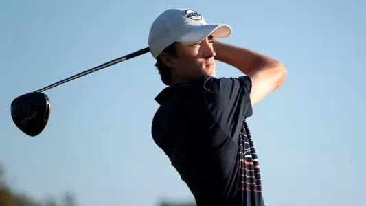 Zack Missigman watches his shot after a swing