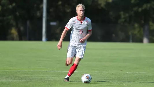 Boyd Curry dribbles upfield looking for teammates