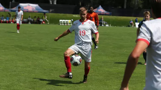 Greg Brighton flips a right-footed pass