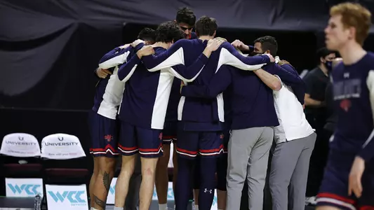 Team huddle at WCC Tournament 2021