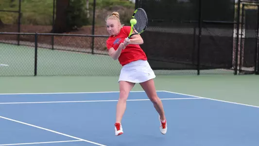 leaping two-handed backhand from Kozyreva