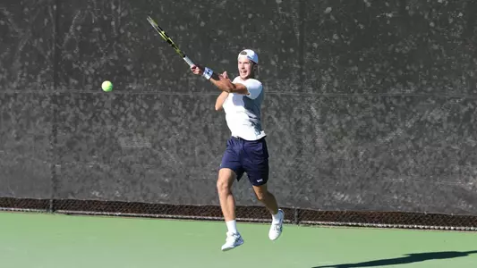 mens tennis player leaping shot