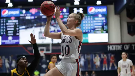 Tayla Dalton layup with video board in background