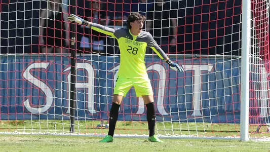Landreth in goal pointing to his right