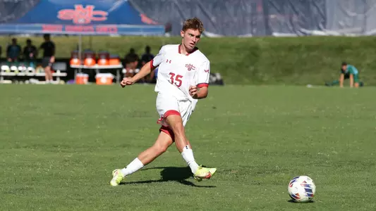 Wade Muttitt passes with his right foot