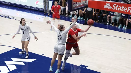 Bamberger lay up vs Rice with Taycee Wedin in background
