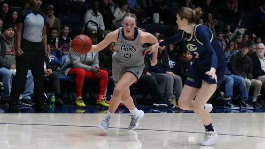 Hannah Rapp dribbles around the corner against UC Davis