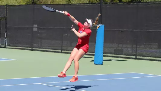 Massey leaping overhand shot in doubles