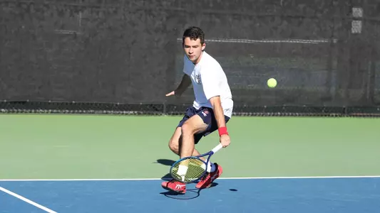 Jakob Ontiveros chases down the ball for a backhand shot