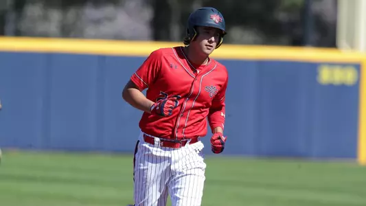 Chris Santiago rounds the bases