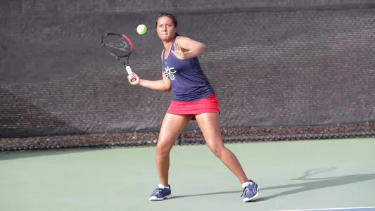 Tevez in red and blue forehand shot