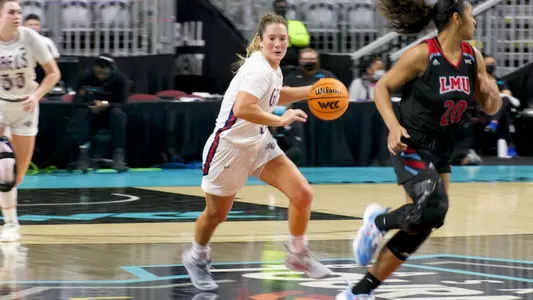 Madeline Holland dribbles upcourt at 2022 WCC tourney