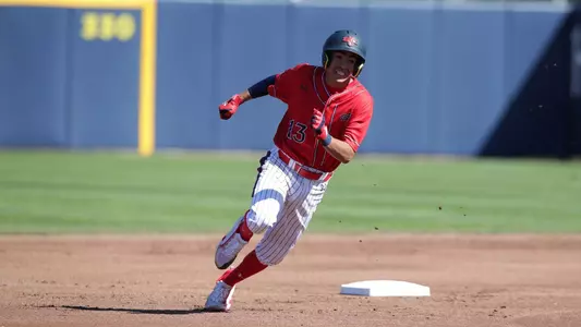 Christopher Campos rounding second base