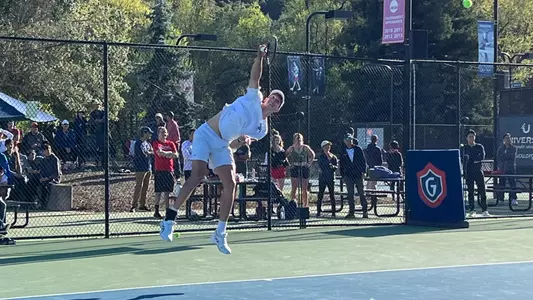 James Watt leaping serve in white kit