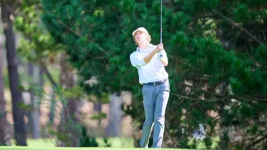 Jonathan Curran shot with trees in background