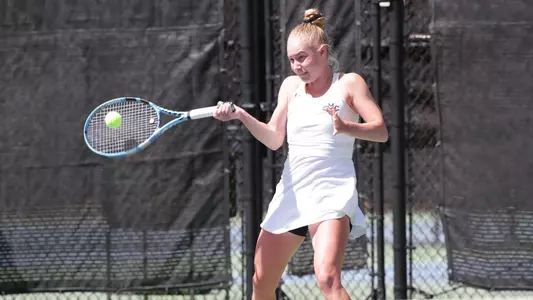 Kozyreva in white one handed senior day 22