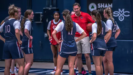 Coach Thomas talks with team at 1st practice