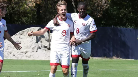 Vestberg and Ngongfor celebrate a goal vs. UC Davis