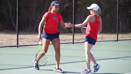 Gabriela Tevez and Jamie Pope high five