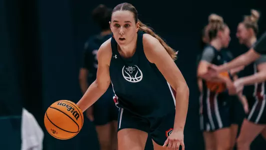 Emily Foy dribbles at open practice