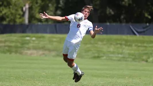 Louis Sterobo leaps up to play a ball off of his chest